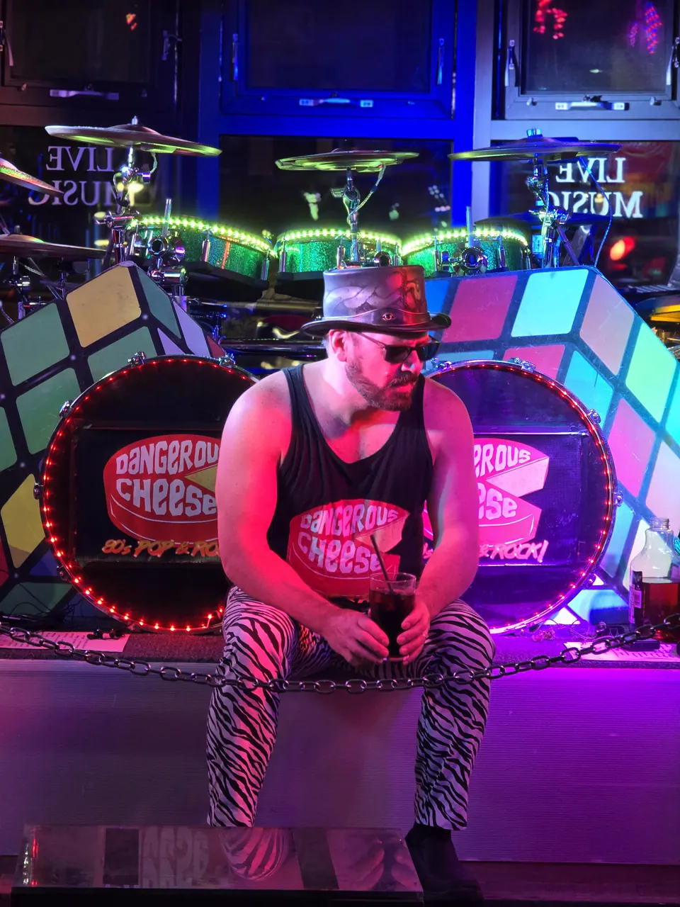 Sean taking a quick break in front of the illuminated Dangerous Cheese drum kit in Banff