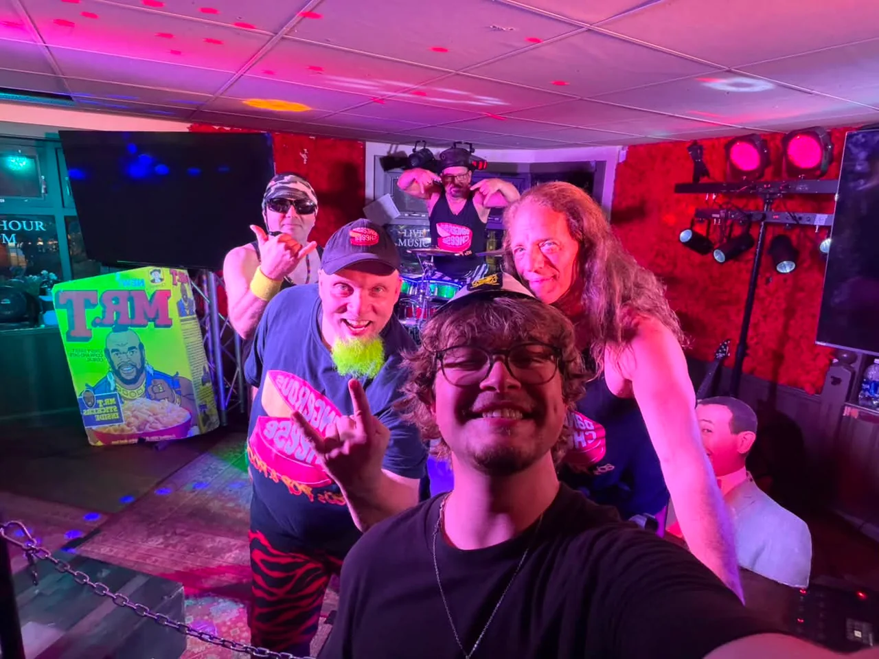 A fan photo with Dangerous Cheese performing on stage at the Rose & Crown in Banff in August 2026
