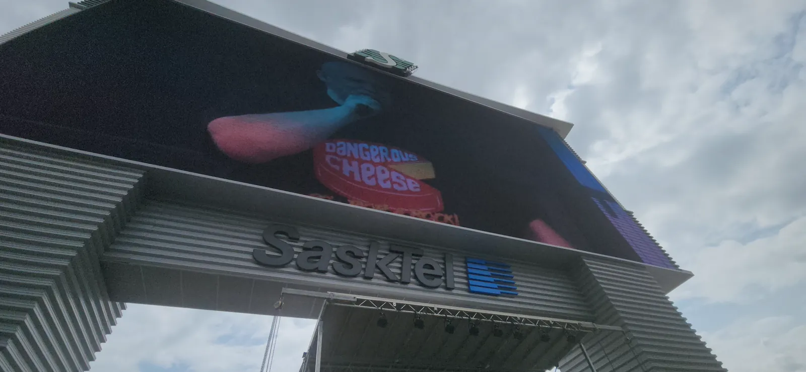 Dangerous Cheese performance shown on the Mosaic Stadium big screen during Family Day